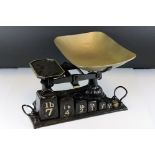 Late 19th / Early 20th century Cast Iron Shop Scales on Stand holding Six Cast Iron Weights