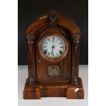 19th century Mantle Clock, the domed top Rosewood Case carved with Face Masks, the white enamel face
