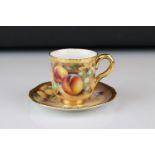 A contemporary Royal Worcester cup and saucer with fruit decoration signed F Roberts.