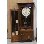 An early 20th century oak cased Gledhill Brook Time Recorder clocking in clock together with a
