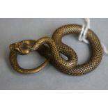 A small metal figure of a viper snake.
