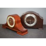 A pair of wooden cased chiming mantle clocks.