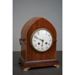 An early 20th century mahogany arch topped chiming mantle clock.