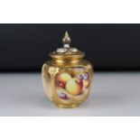 A late 20th century Royal Worcester lidded gilt vase fruit decorated panels signed Frank Roberts.