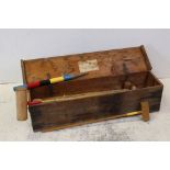 A vintage garden croquet set in original wooden box.