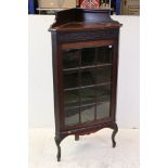 Early 20th century Mahogany Corner Display Cabinet with blind fretwork carving and single glazed