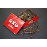 Quantity of antique keys in an OXO tin