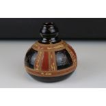 A 20th century David Gaitskell studio pottery onion shaped vase with brown and red glazed panels,
