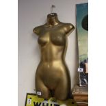 A contemporary plastic Golden torso .