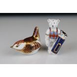 A Royal Crown Derby Wren paperweight silver stopper and a similar Teddy Bear golfer.