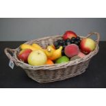 Basket of artificial fruit for display purposes