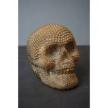 A decorative resin Golden skull ornament.