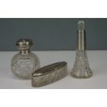 A group of three cut glass dressing table bottles to fully hallmarked sterling silver collars and