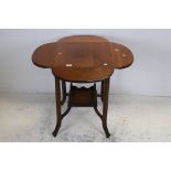 Early 20th century Oak Side Table with four drop flaps, under tier shelf and raised on four