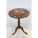 George III Oak Circular Tilt Top Table on gun barrel column and three splayed legs, 64cms diameter x