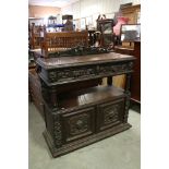 Victorian Dark Oak Buffet, profusely carved including Green Man Masks, comprising two drawers over a