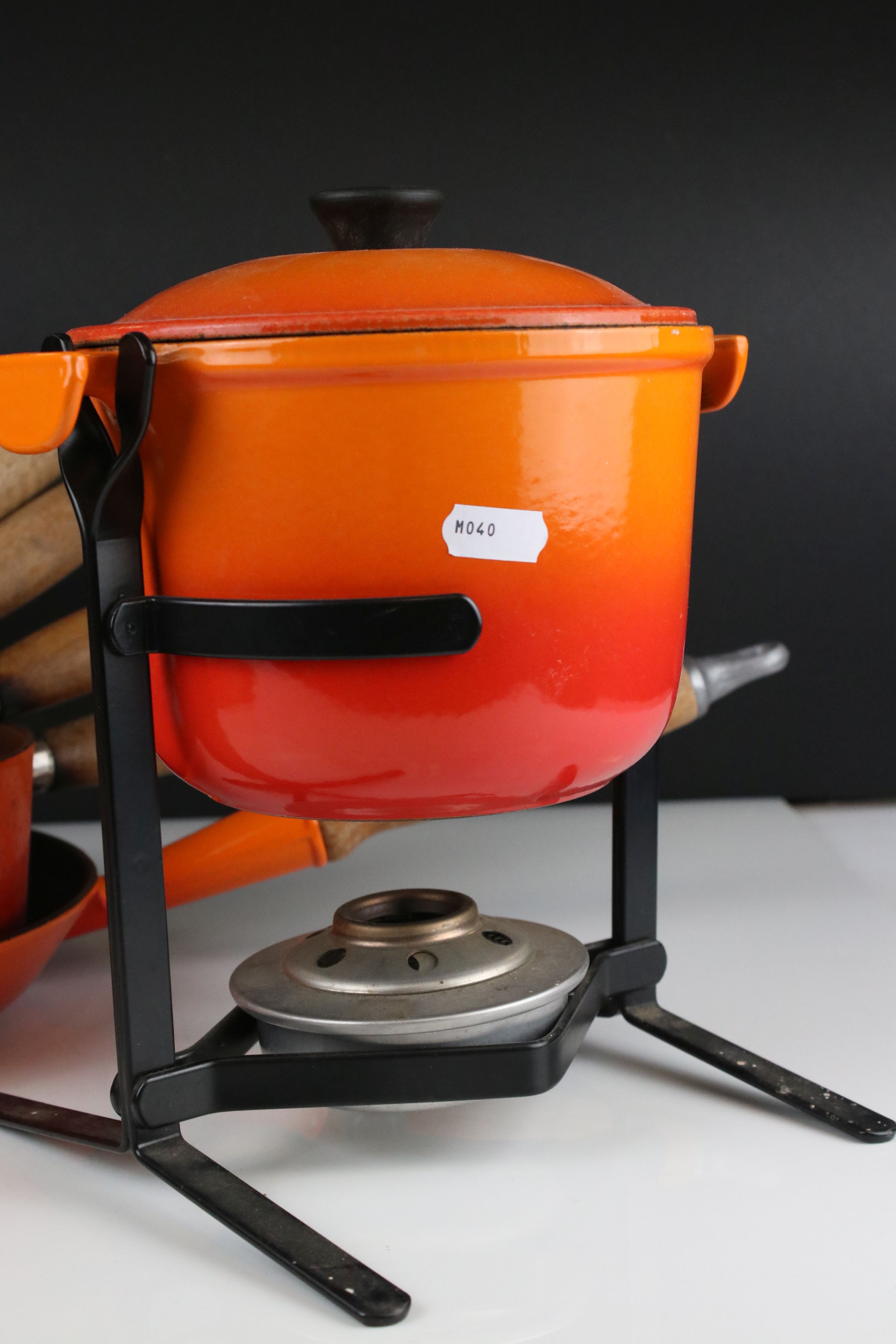 A collection of Le Creuset cast iron red pots and pans together with a fondue pan and burner. - Image 3 of 6