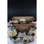 A collection of fifteen pieces of Torquay pottery to include tea pot, jugs and sugar bowl.
