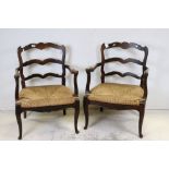 Pair of late 19th century French oak armchairs, with rush seats, on cabriole legs, approx. 59.5cm