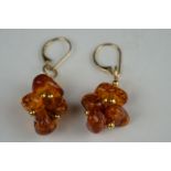 Pair of yellow gold and amber style drop earrings