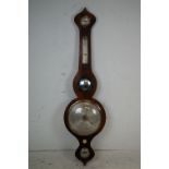 An antique mahogany banjo barometer.