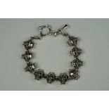 Silver skull bracelet, with bone shaped clasp