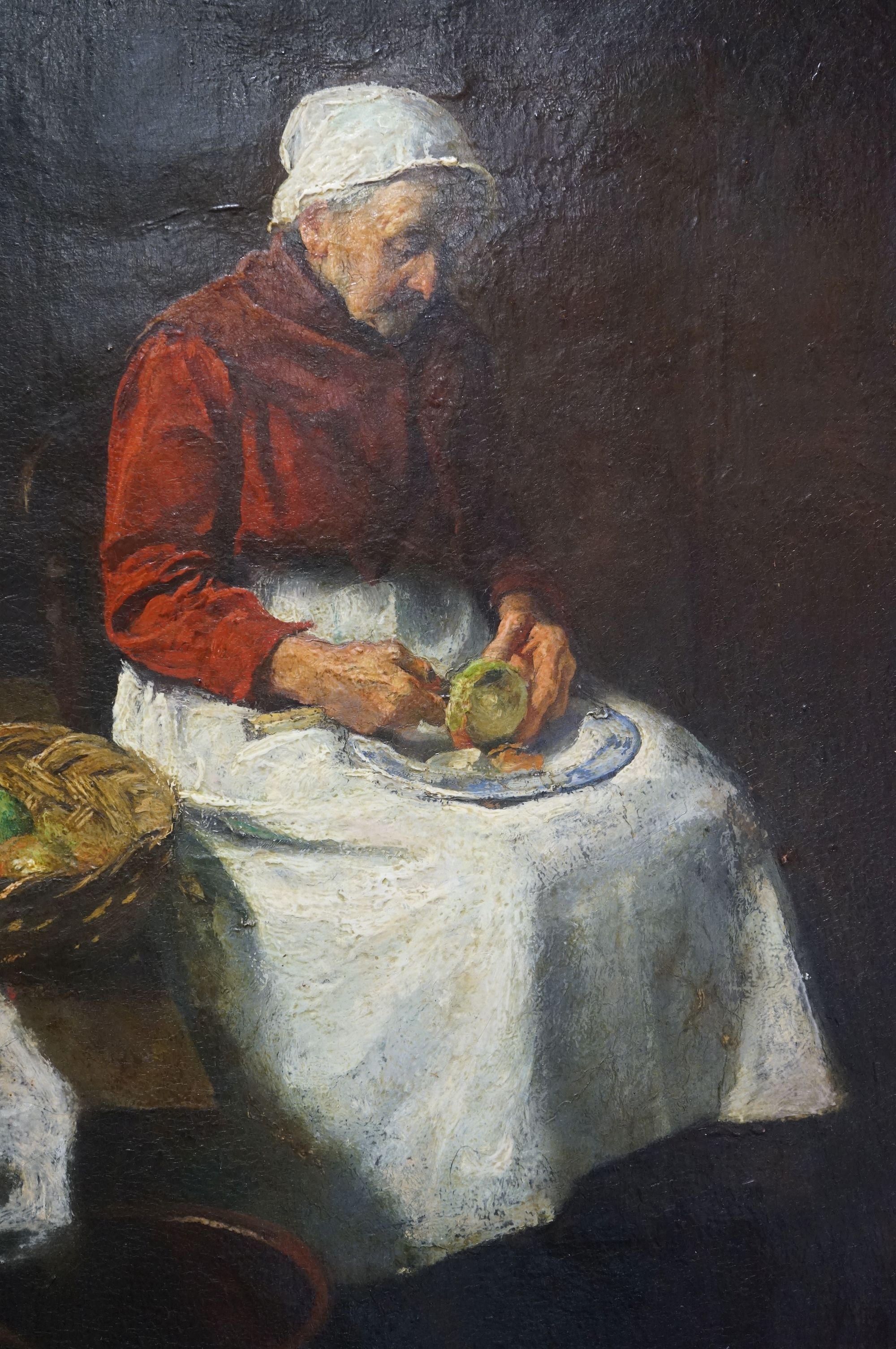 A 19th century oil on canvas of a seated old woman in an interior setting with basket of fruit, - Image 2 of 3