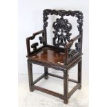 Chinese Hardwood Open Armchair with carved back rail and splat, solid seat, raised on square legs