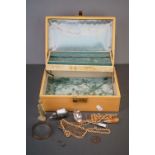 A small group of collectables contained within a vintage jewellery box to include a Pig vesta case