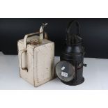 A vintage black railway warning lantern together with a valour fuel can.