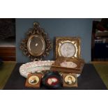 An oval antique framed wax silouhette of gent in wig, pair of composite framed classical plaques