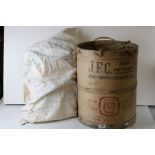 A vintage Jersey Farmers Co-Operative wooden potato bucket.
