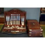 A antique writing slope with brass mounts and banding together with a canteen of cutlery.