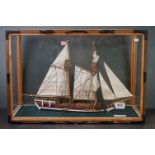 Glass cased armed schooner, HMS Berbice, in a natural sea scene, approx. 56cm x 38cm x 25cm