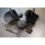 A copper coal scuttle together with a copper kettle and a copper coal bucket.