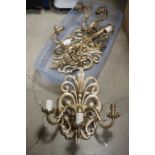 A pair of gilt metal three branch wall sconces.