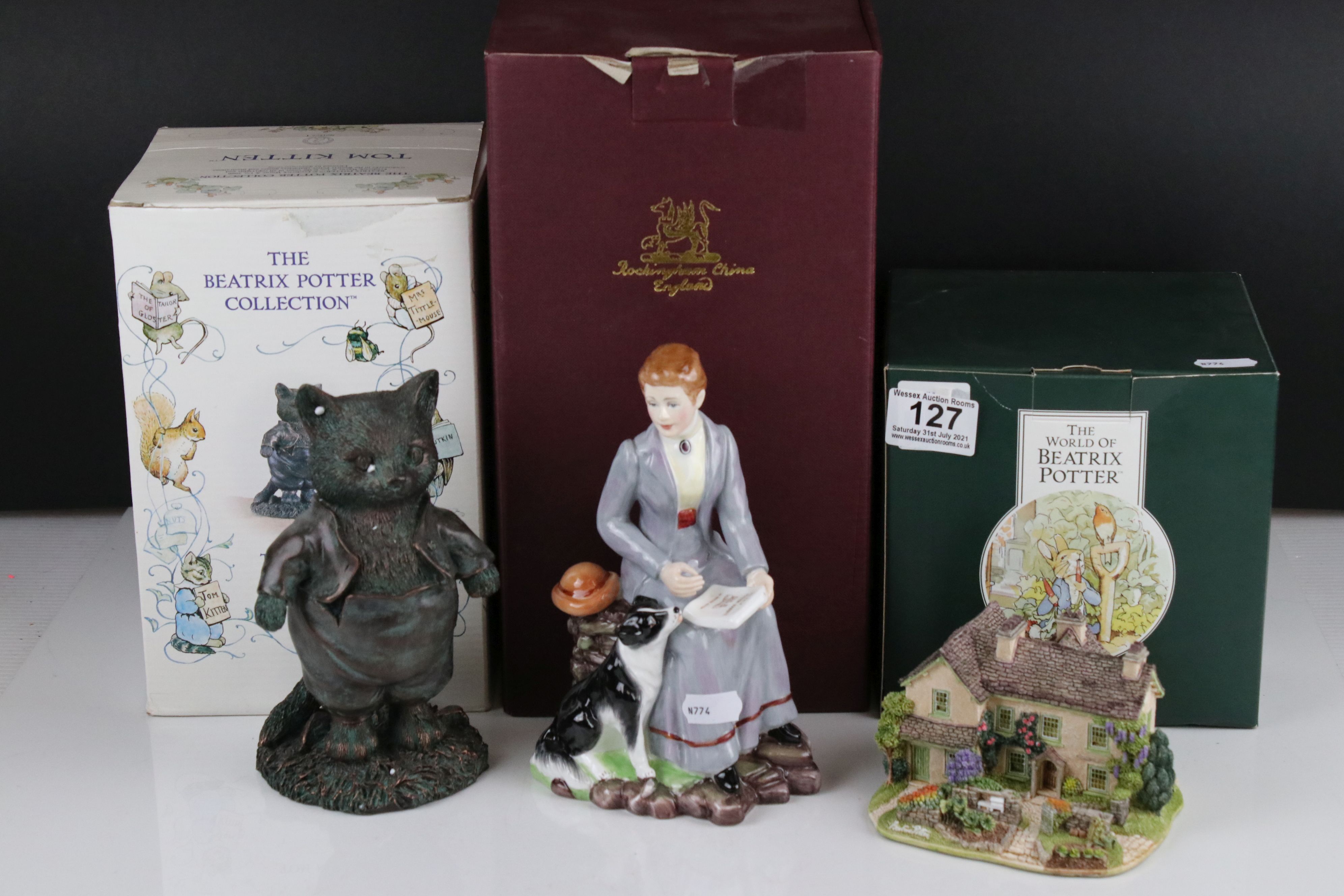 A group of Beatrix Potter collectables to include a bronzed Tom Kitten figure, a Lilliput Lane