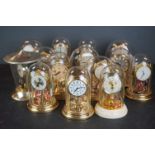 A collection of fourteen dome topped anniversary clocks to include Ranela and Kienzle examples.