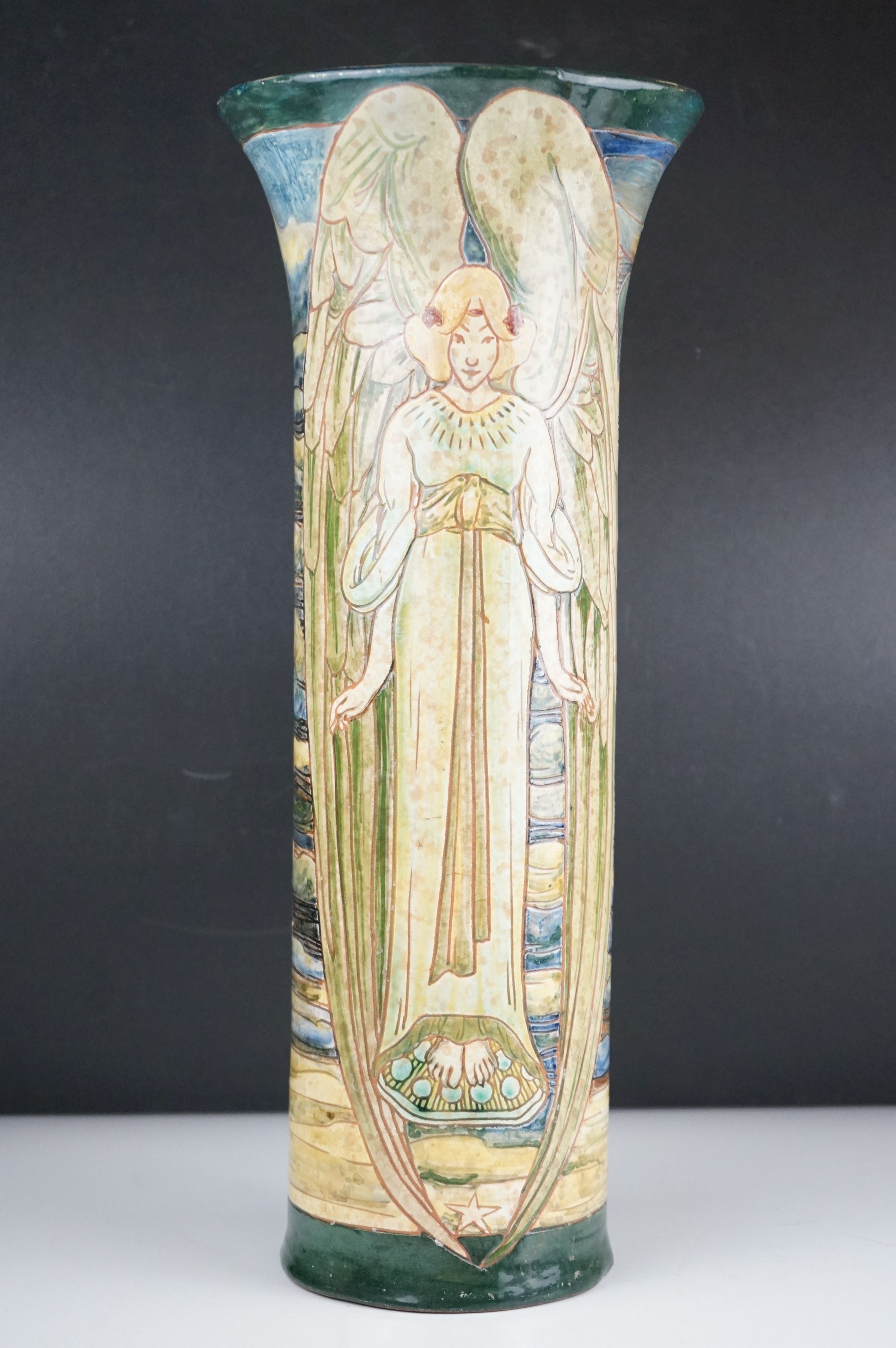 A large Art Nouveau Della Robbia Pottery Cylindrical vase decorated with Angels by Cassandia Anni