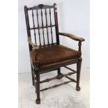 Late 18th century ash and elm armchair with spindle back, rush seat and tapered legs joined by