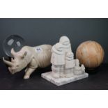 A group of mixed collectables to include a carved stone Rhino, carved stone Inuit figures and a