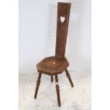 Hardwood Spinning Chair, the back pierced with a heart and carved with a Chinese Dragon, 96cms high
