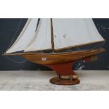 Edwardian pond yacht on stand with plank on frame, mahogany hull with lead weighted keel, lined
