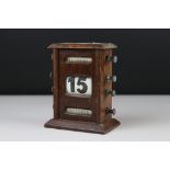 An early 20th century oak cased desk topped perpetual calender.