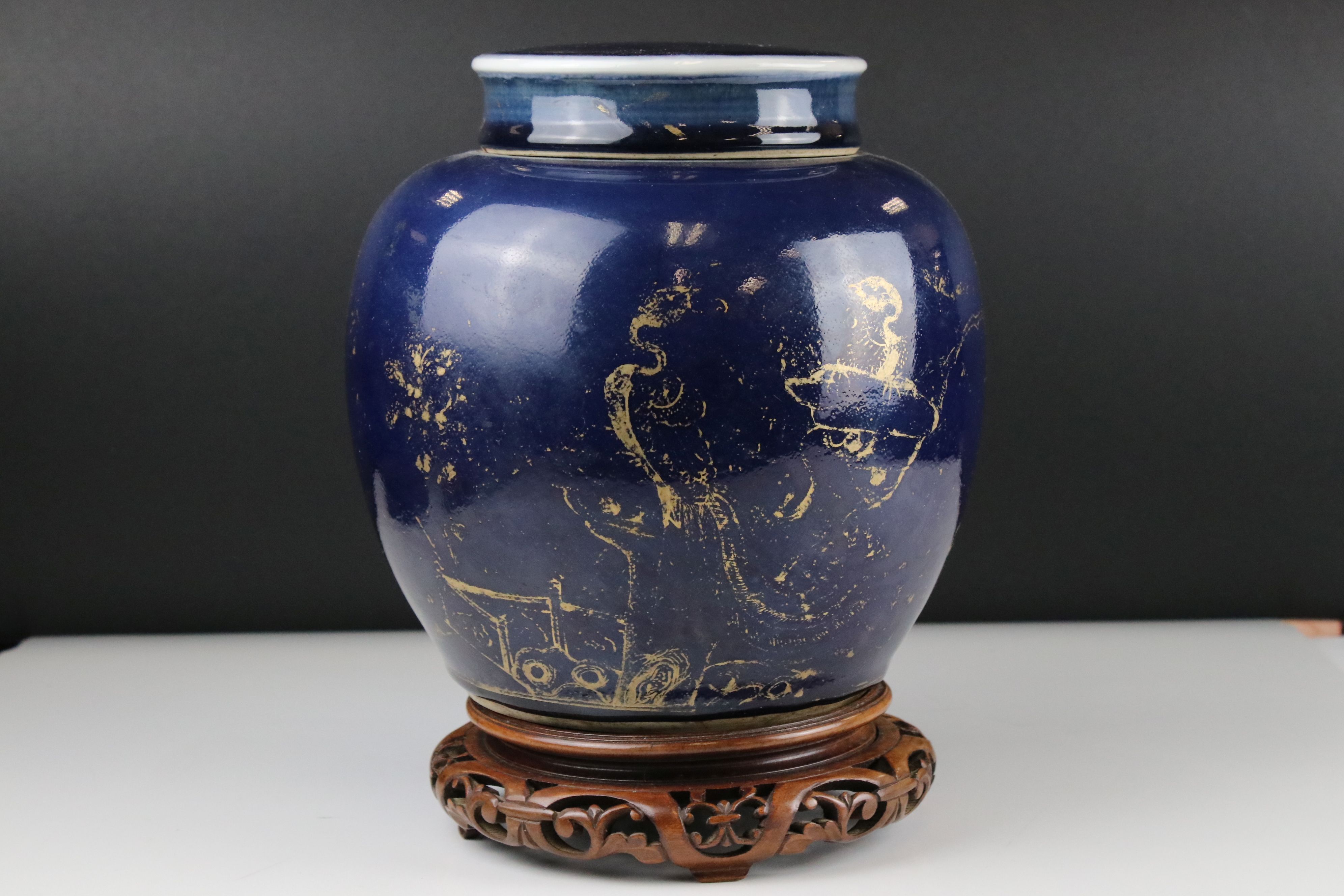 Chinese Blue ground ovoid lidded Vase with rubbed gilt decoration, 22 cm tall together with a carved