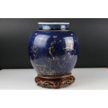 Chinese Blue ground ovoid lidded Vase with rubbed gilt decoration, 22 cm tall together with a carved
