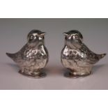 Pair of white metal bird condiment shakers