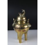 Chinese brass three legged Censer with mask handles and Dragon to lid, 33 cm tall