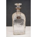 A cut glass whisky decanter with fully hallmarked sterling silver collar a silver Whiskey label.