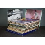 A collection of vinyl LP's and 12" singles to include Wings, Roxy Music and Diana Ross.